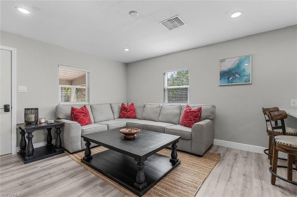 16075 Quail Trail Bokeelia, FL 33922 - Photo 6 of 24 a living room with furniture and wooden floor
