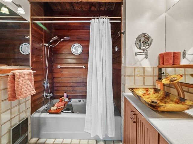 a bathroom with a sink and a shower