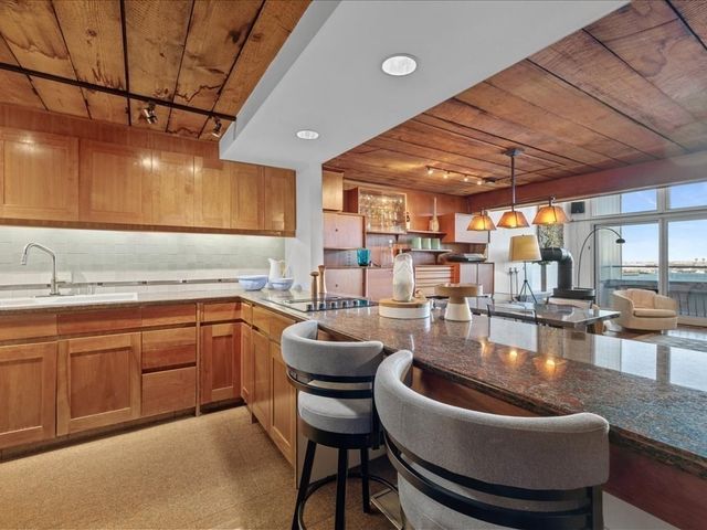 a kitchen with a table and chairs