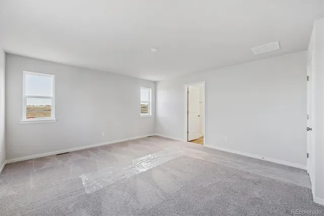 an empty room with windows