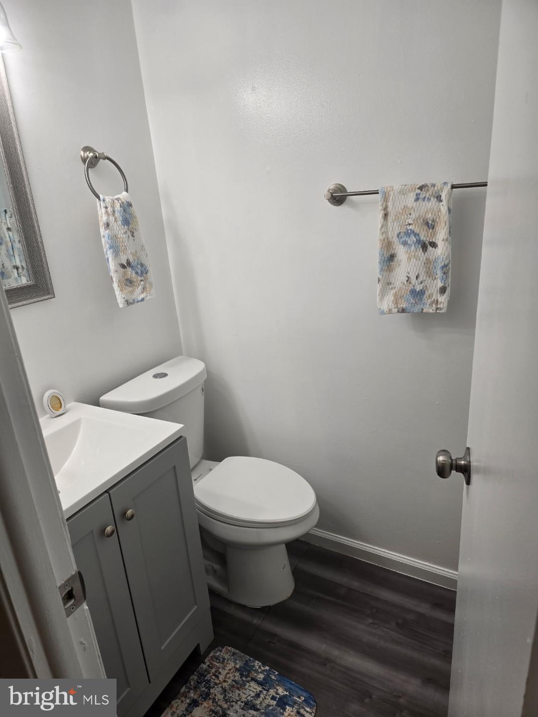 8512 Imperial Drive, Unit 1H Laurel, MD 20708 - Photo 13 of 14 a white toilet sitting next to a bathroom sink