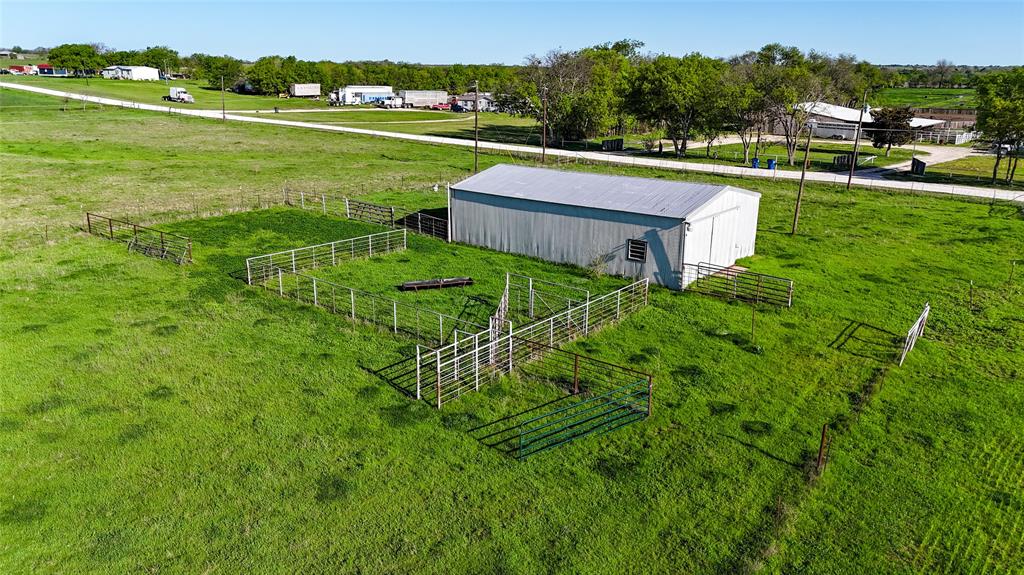 2007 Valley View Valley View, TX 76272 - Photo 7 of 10 View of rural area featuring agricultural land and a tree filled landscape