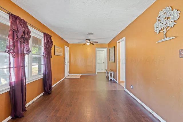 a view of an entryway with wooden floor