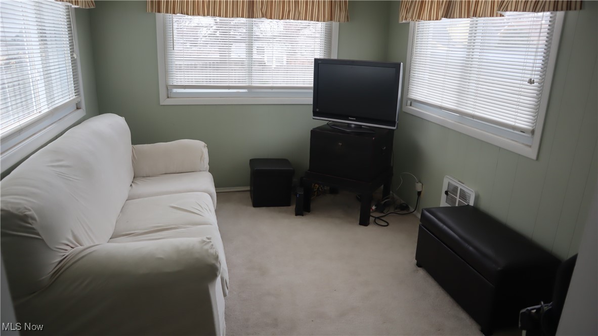 4213 Stonehaven Road Cleveland, OH 44121 - Photo 3 of 21 Living area with carpet and a healthy amount of sunlight