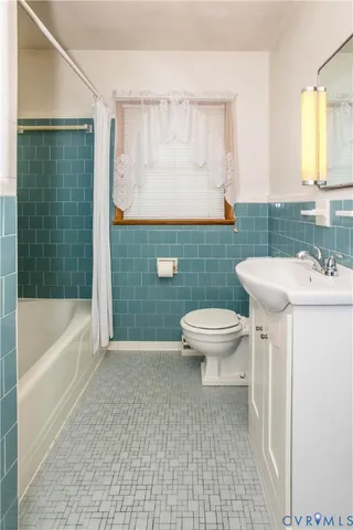 a view of a house with yard and sitting area