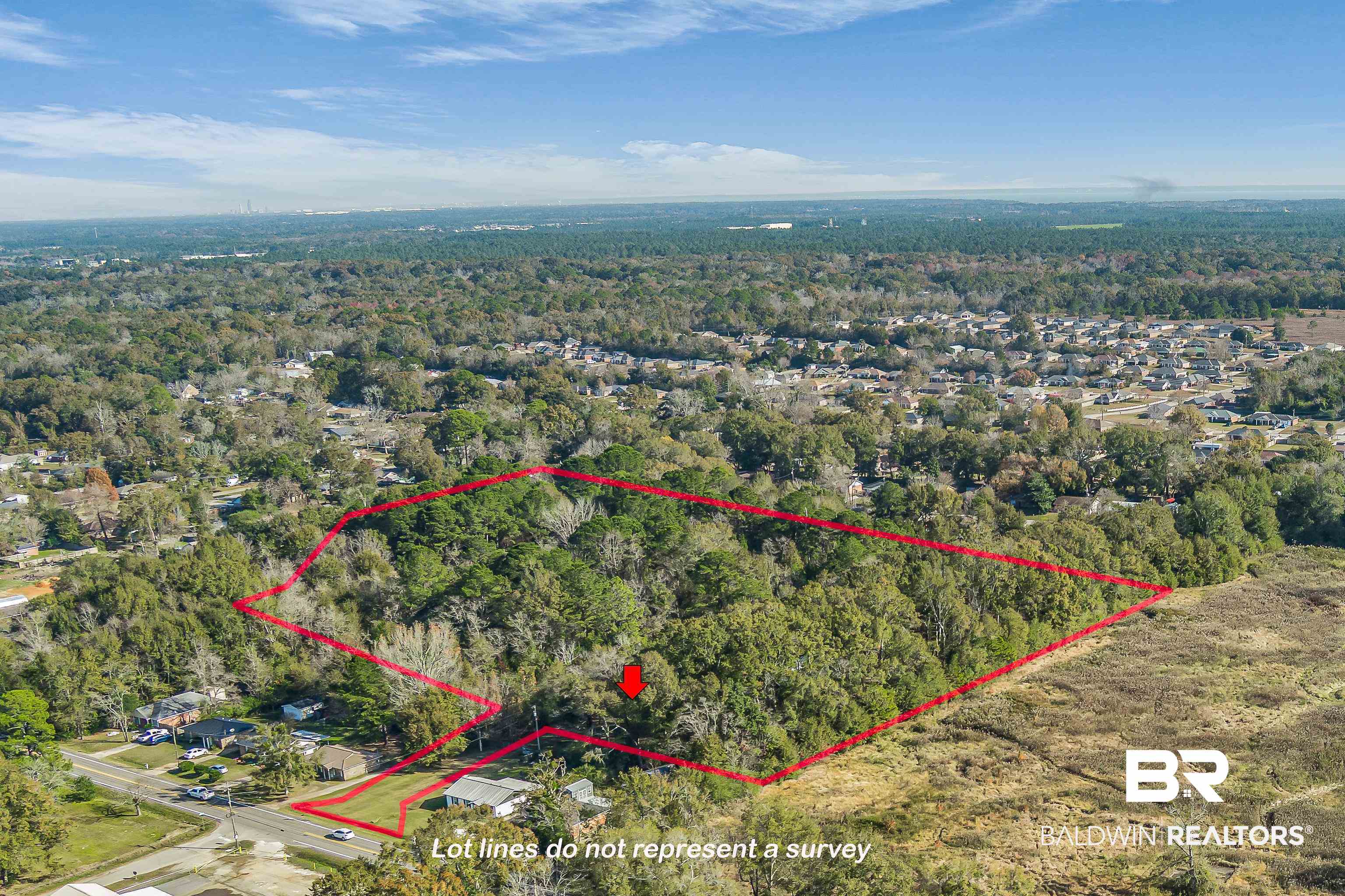 7787 Bellingrath Road Theodore, AL 36582 - Photo 2 of 36 Aerial view of property and surrounding area with property boundaries highlighted and a heavily wooded area