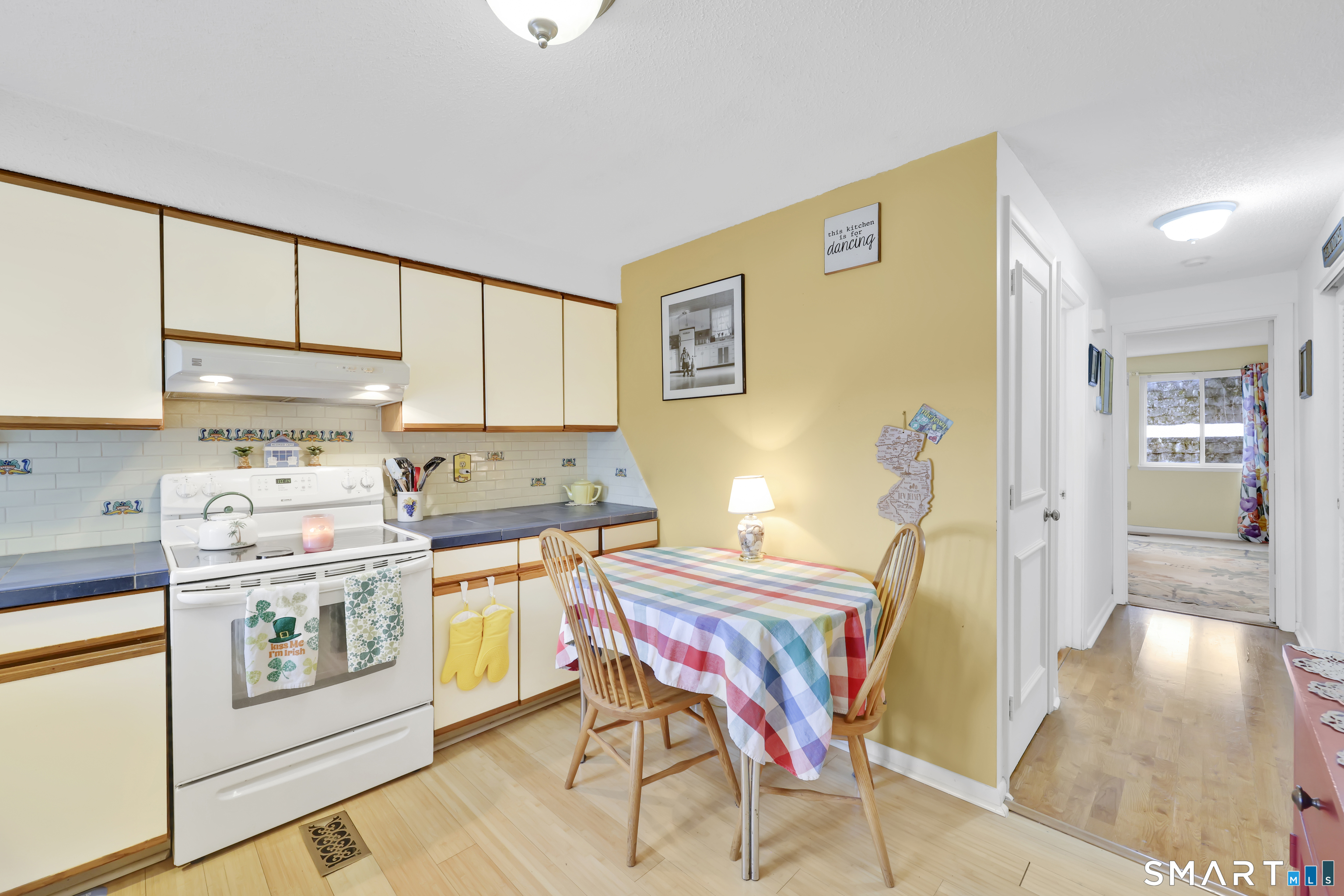 260 Brittany Farms Road, Unit B New Britain, CT 06053 - Photo 15 of 34 a view of kitchen and dining area with furniture
