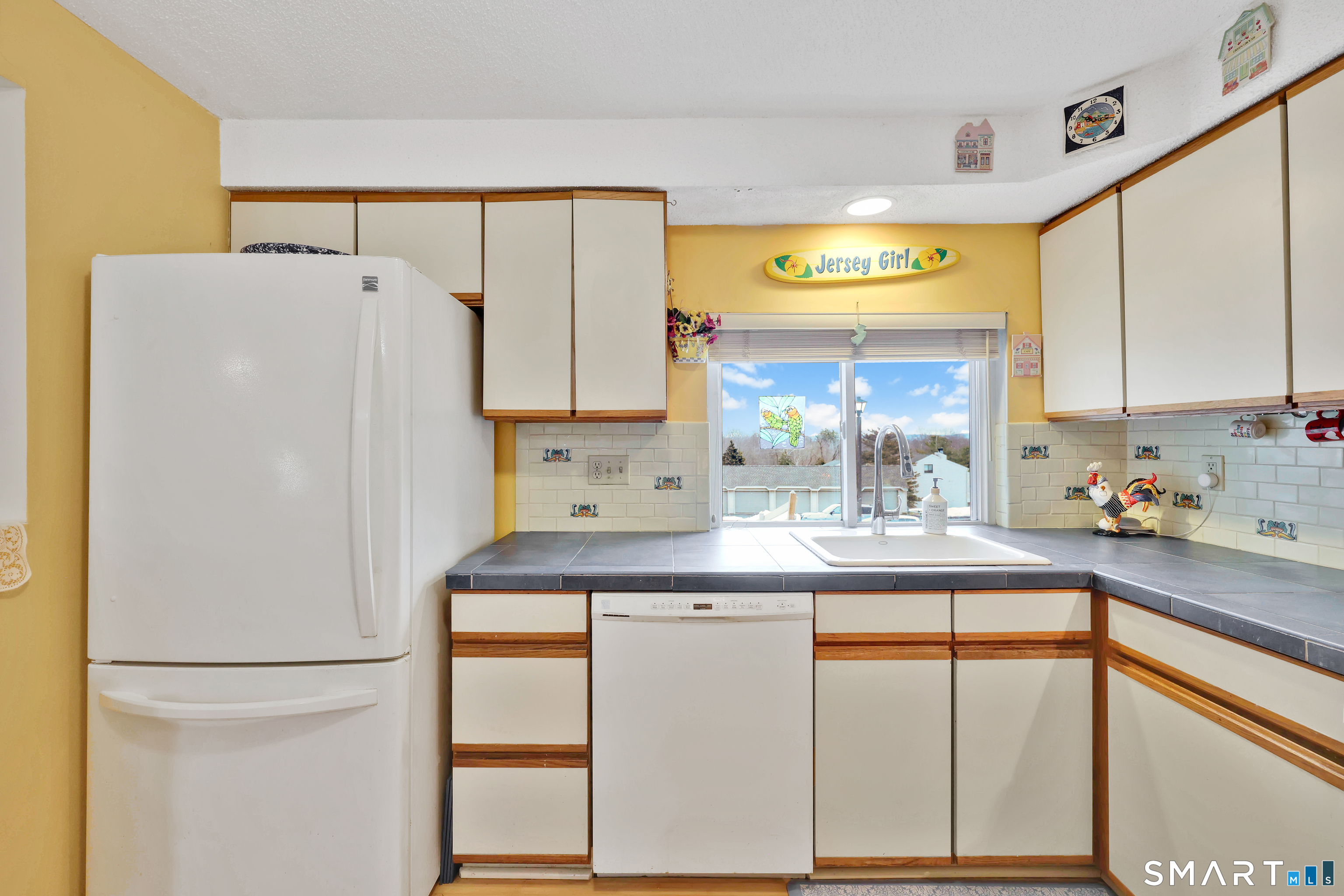 260 Brittany Farms Road, Unit B New Britain, CT 06053 - Photo 18 of 34 a kitchen with a refrigerator and a sink