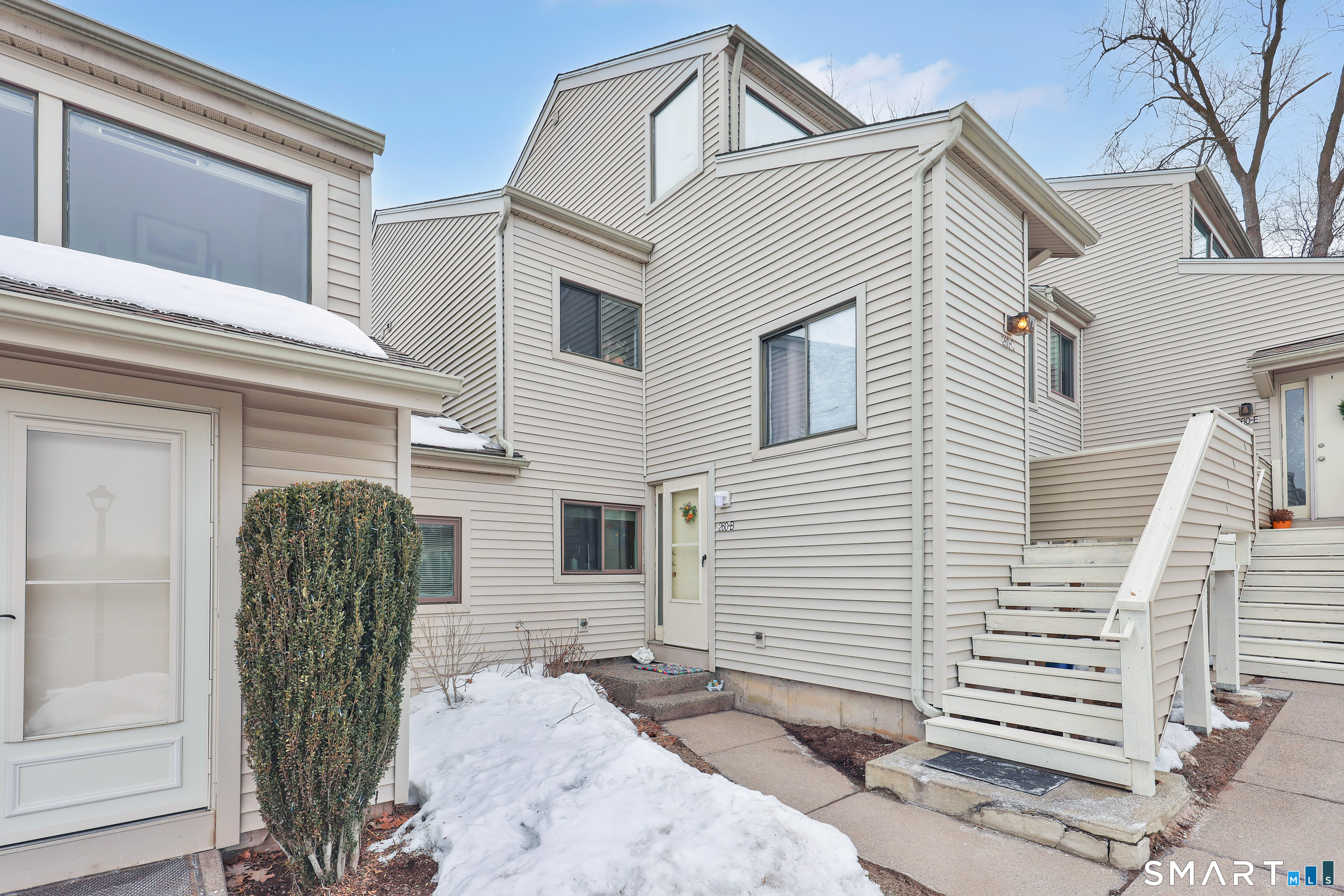 260 Brittany Farms Road, Unit B New Britain, CT 06053 - Photo 2 of 34 a view of a front of house with large windows