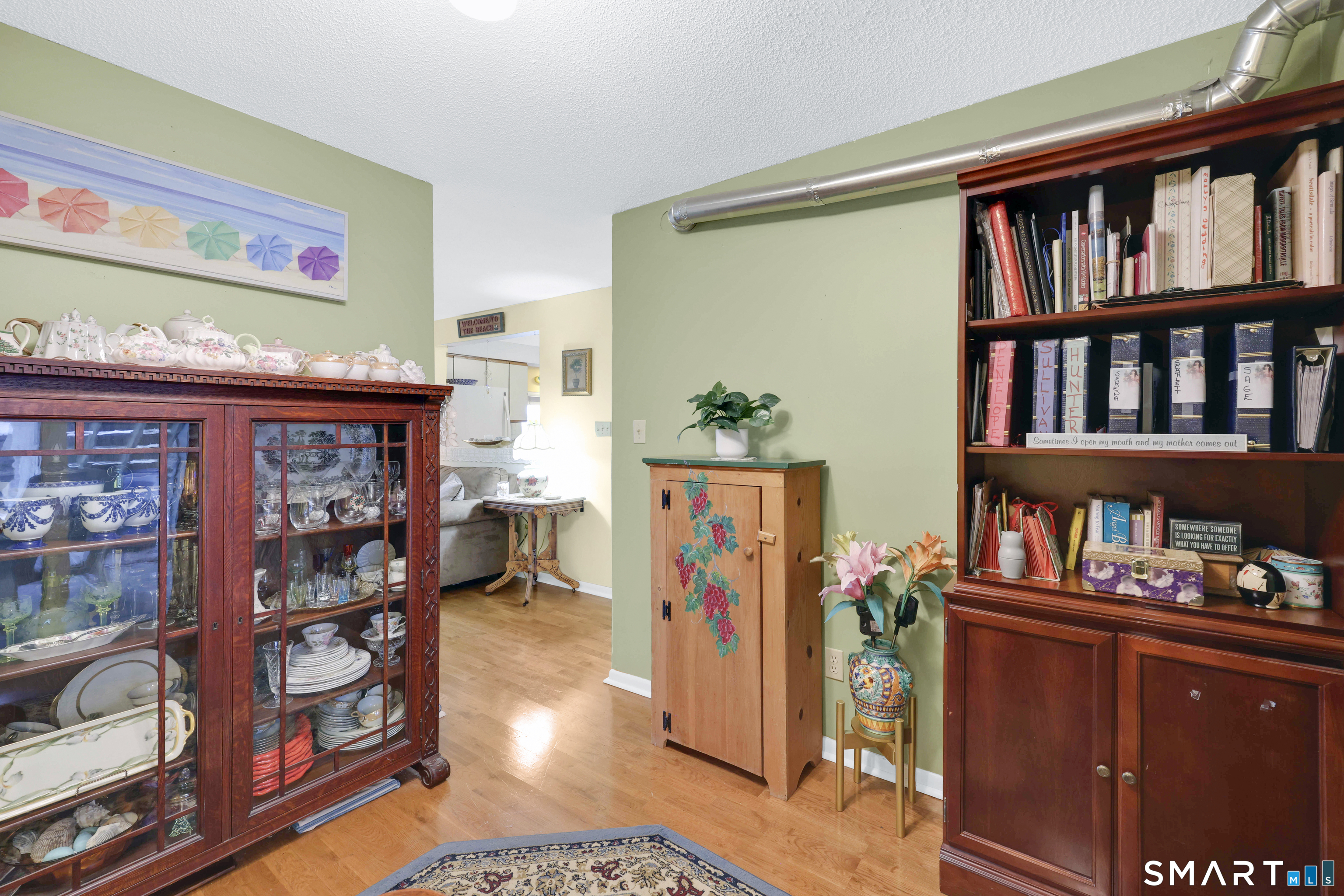 260 Brittany Farms Road, Unit B New Britain, CT 06053 - Photo 21 of 34 a living room with lots of furniture and baby crib
