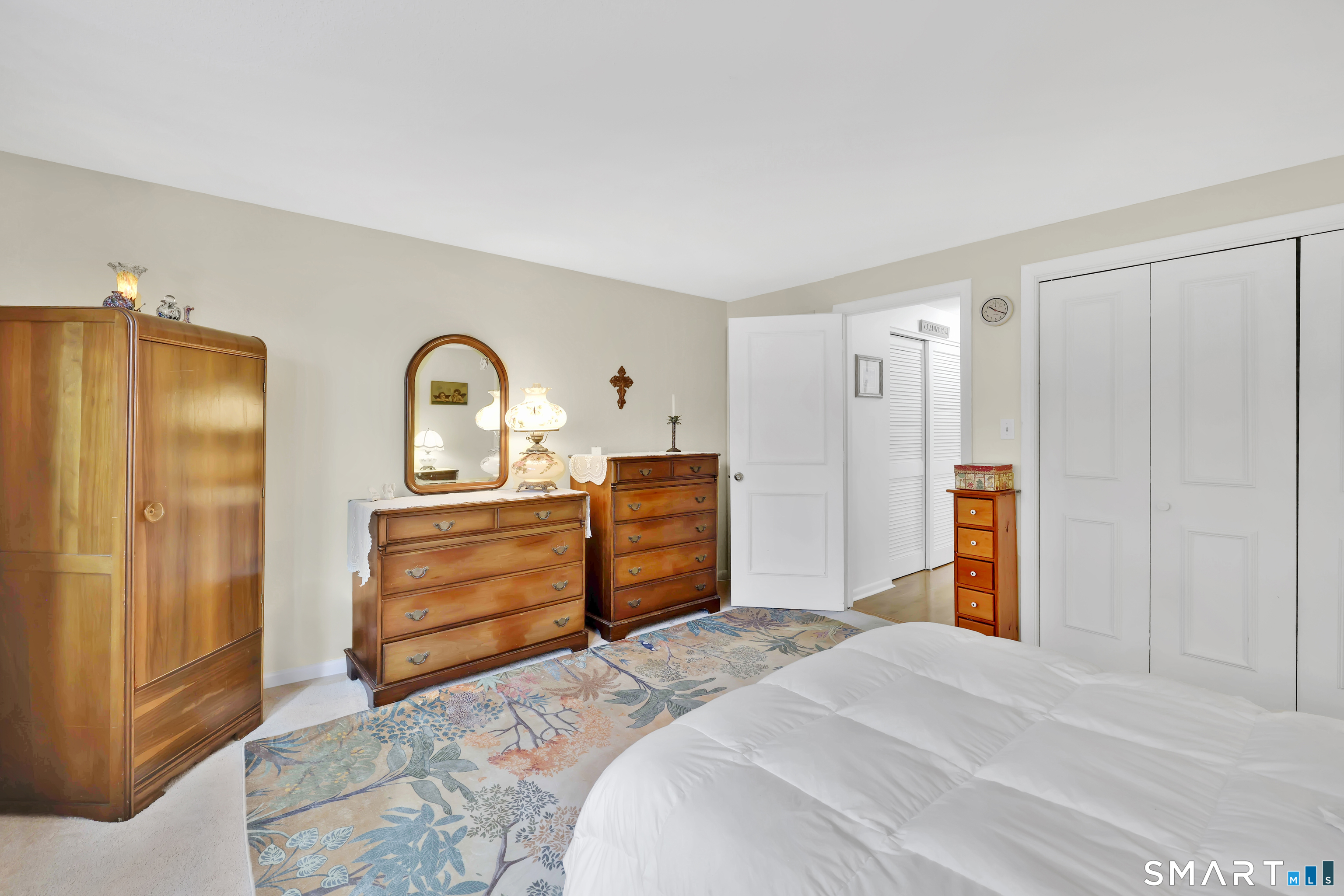 260 Brittany Farms Road, Unit B New Britain, CT 06053 - Photo 25 of 34 a bedroom with a bed and a dresser