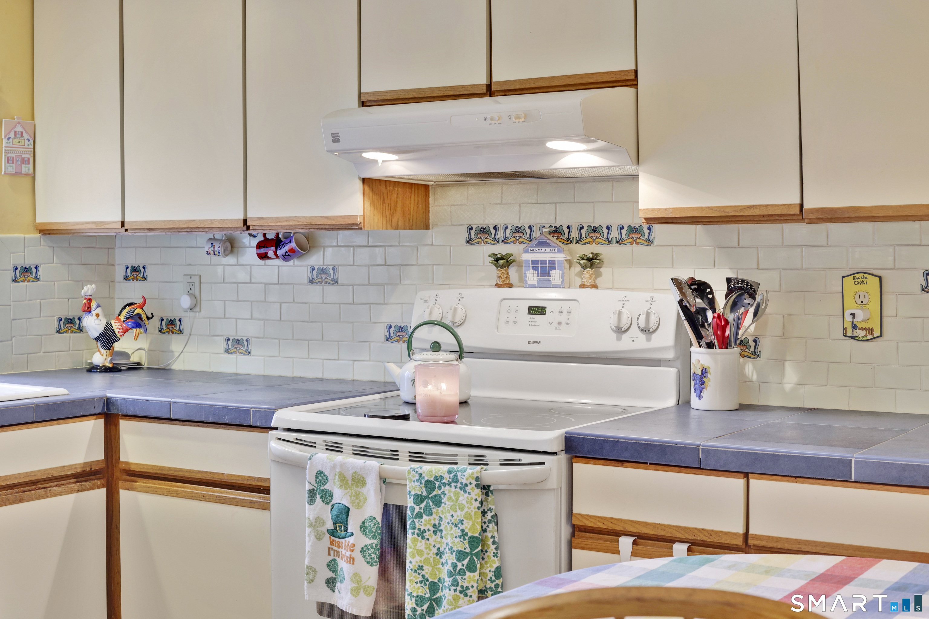 260 Brittany Farms Road, Unit B New Britain, CT 06053 - Photo 28 of 34 a kitchen with kitchen island granite countertop a sink a stove and cabinets