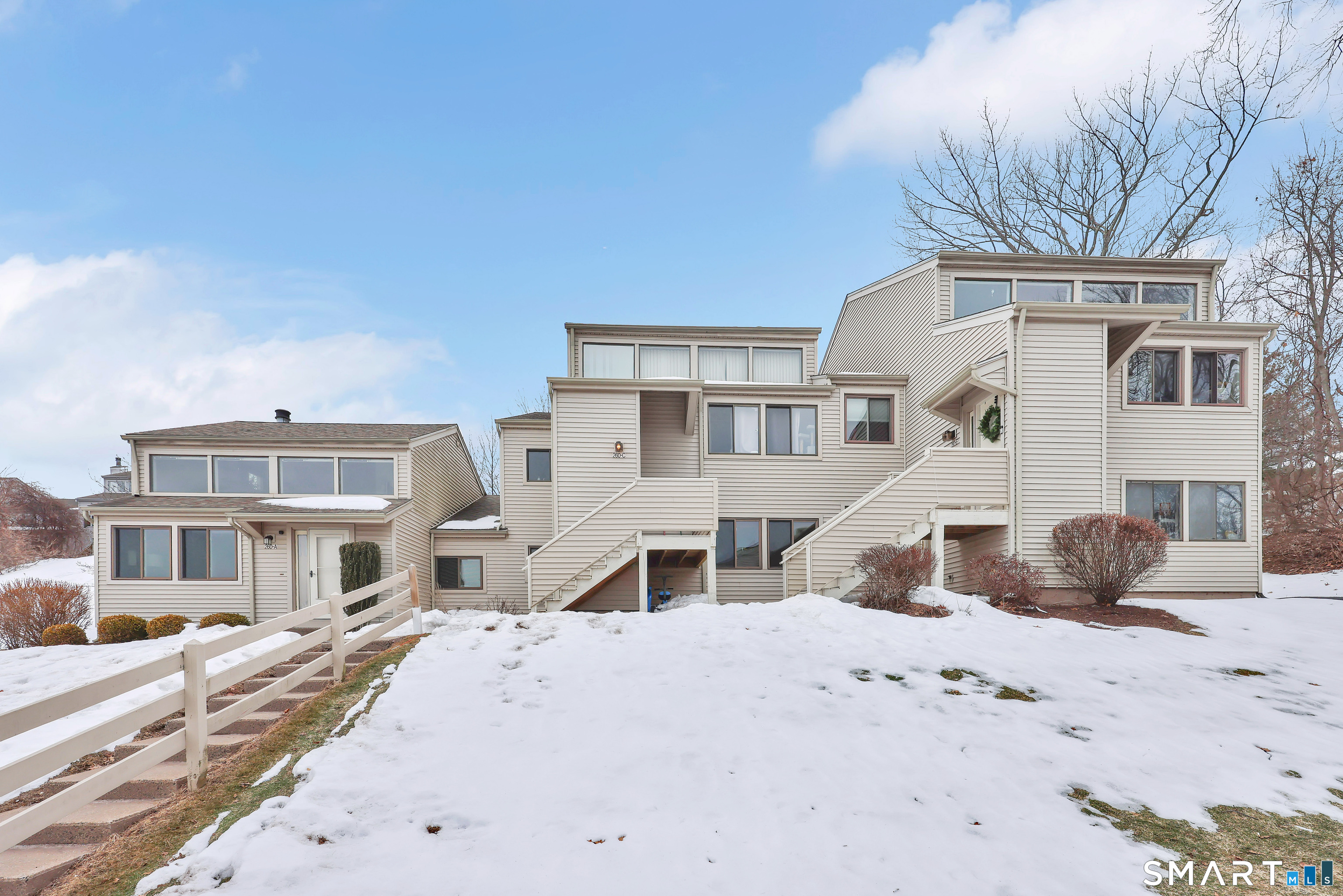260 Brittany Farms Road, Unit B New Britain, CT 06053 - Photo 3 of 34 a front view of a house with a yard