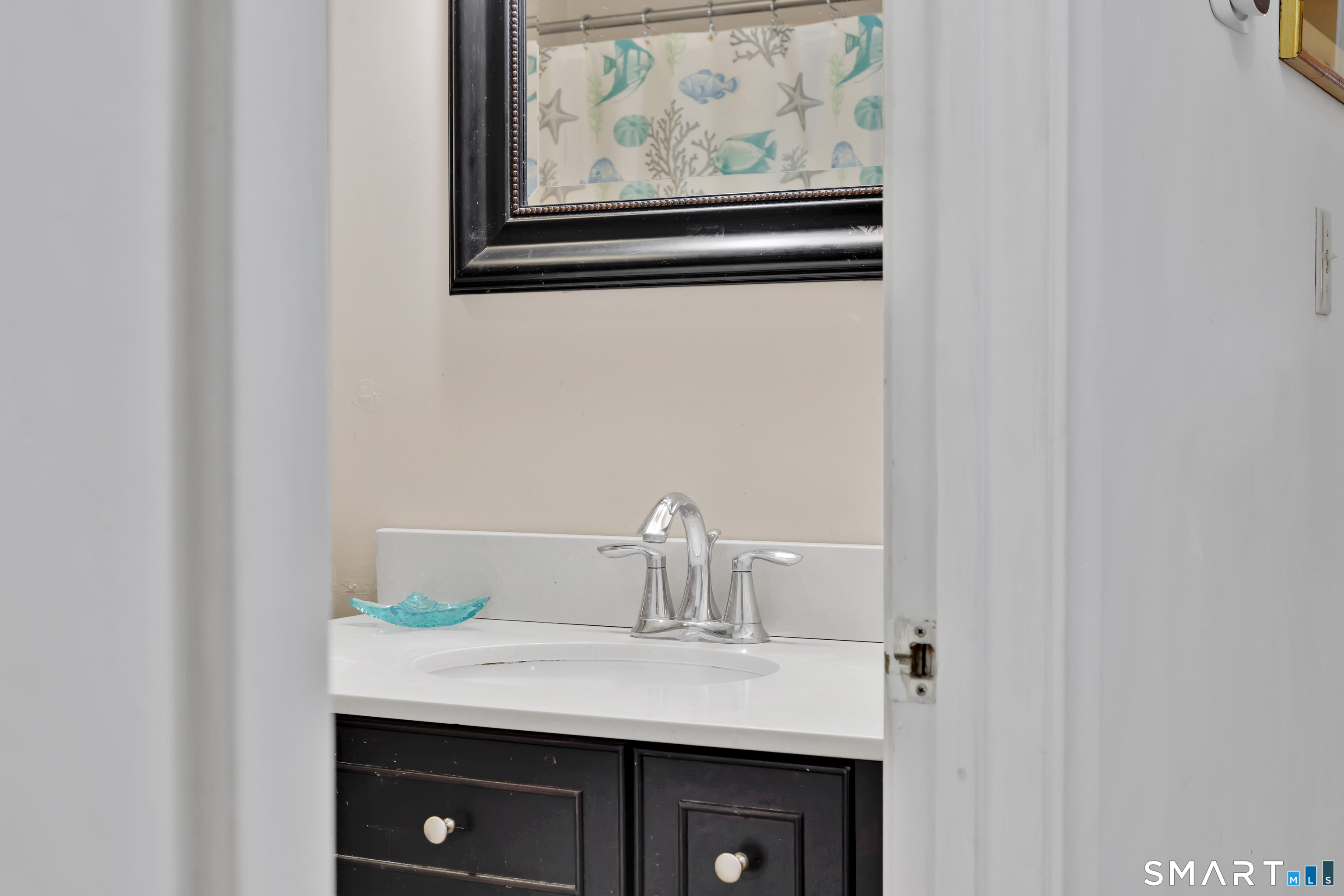 260 Brittany Farms Road, Unit B New Britain, CT 06053 - Photo 33 of 34 a sink with a mirror