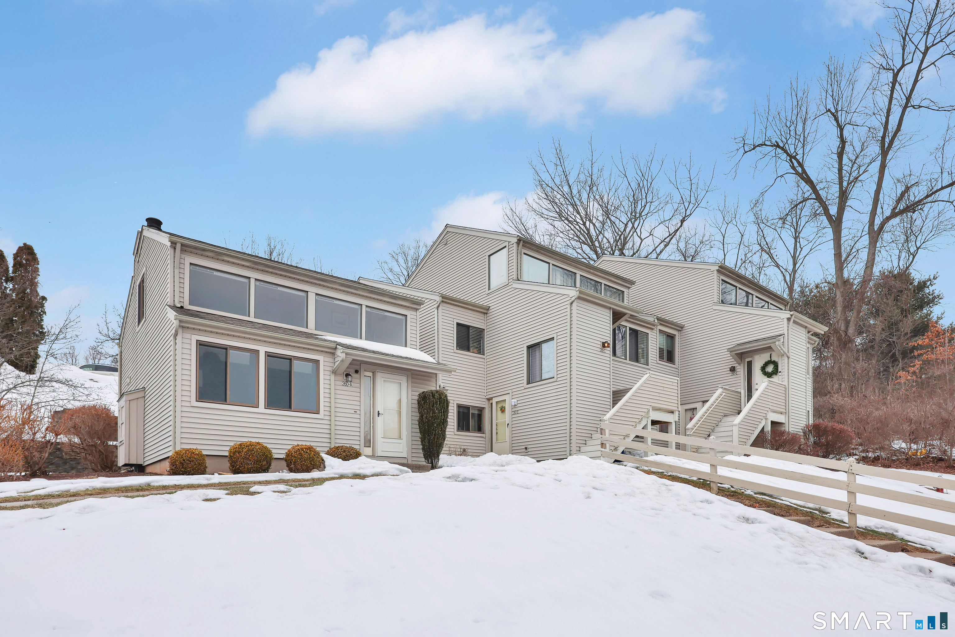 260 Brittany Farms Road, Unit B New Britain, CT 06053 - Photo 4 of 34 a large building with a large tree in front of it