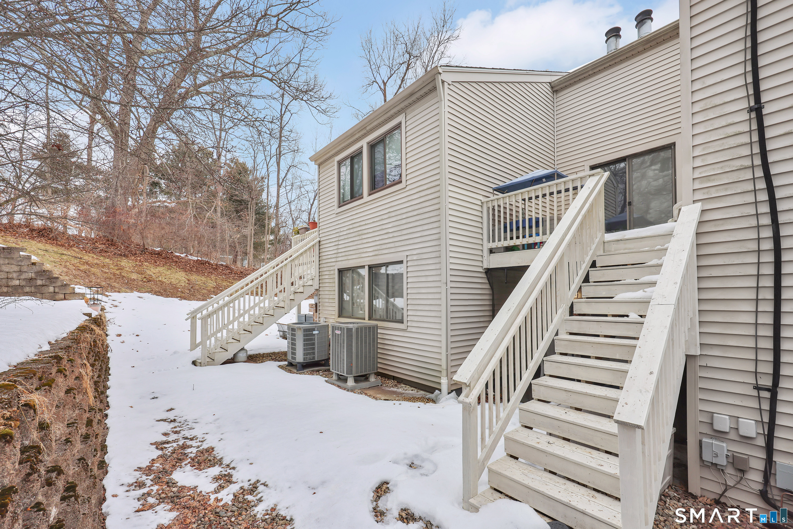 260 Brittany Farms Road, Unit B New Britain, CT 06053 - Photo 7 of 34 a view of a house with a snow