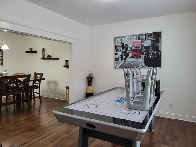 a view of a dining room with furniture and wooden floor