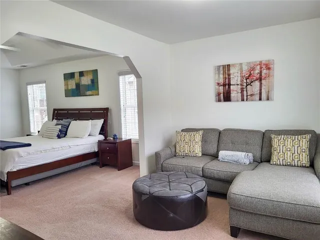 a bedroom with furniture and a couch