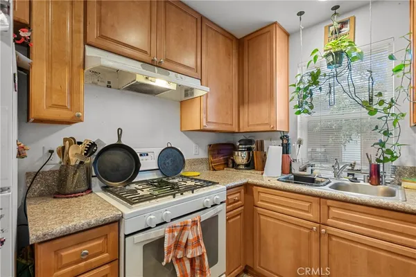 a kitchen with a stove and cabinets