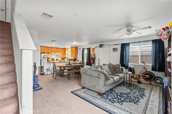 a living room with furniture and a table