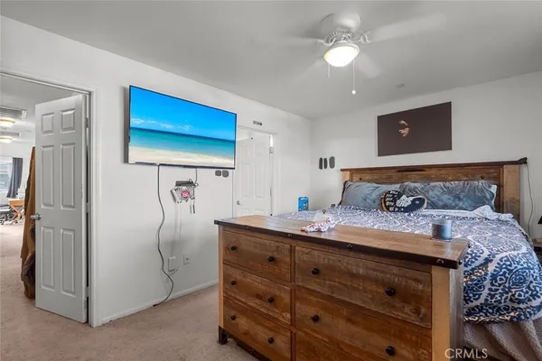 a bedroom with a bed and a walk in closet
