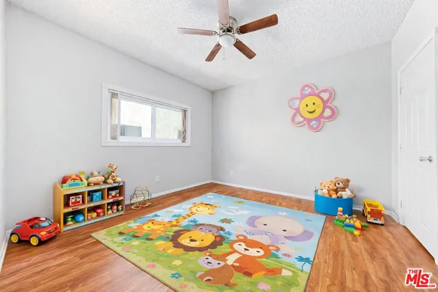 a bed room with furniture and a baby crib