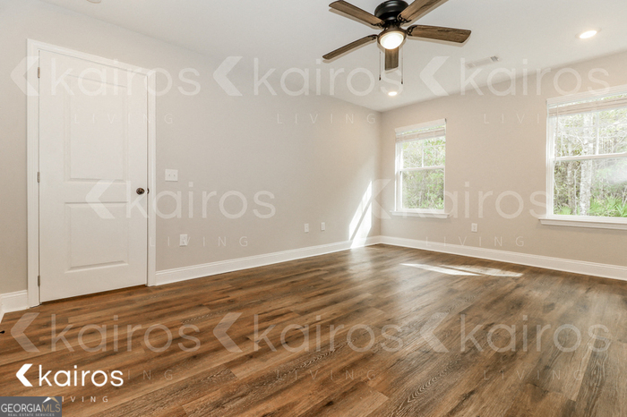153 Cottage Grove Road Brunswick, GA 31525 - Photo 9 of 16 a view of an empty room with a window