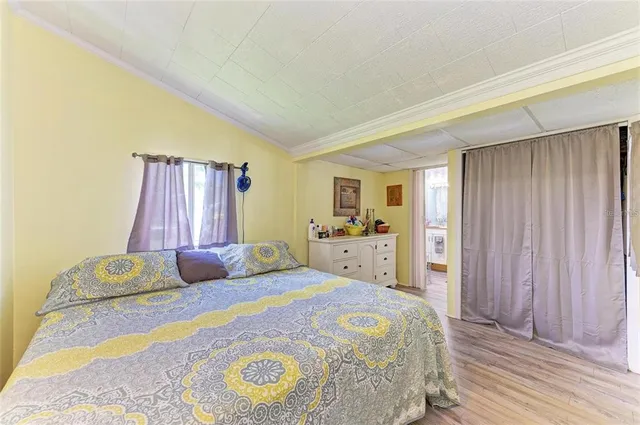 a bedroom with a bed and a closet