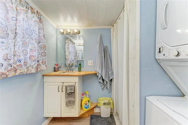 a bathroom with a sink a mirror and a bathtub