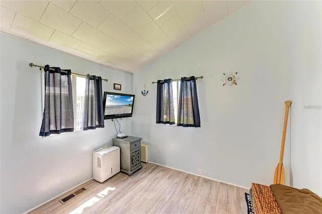 a view of a livingroom with furniture and staircase