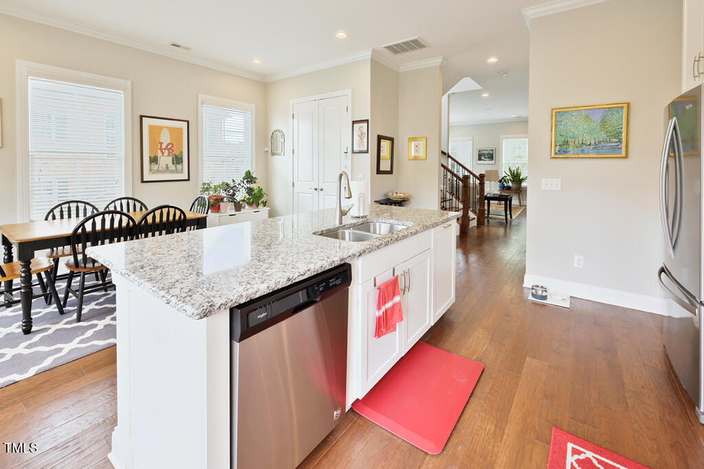910 Wake Towne Drive Raleigh, NC 27609 - Photo 11 of 45 a view of a kitchen and dining room
