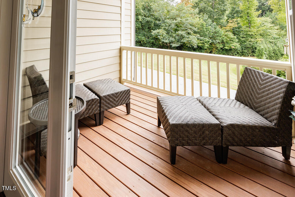 910 Wake Towne Drive Raleigh, NC 27609 - Photo 15 of 45 a balcony with a couch