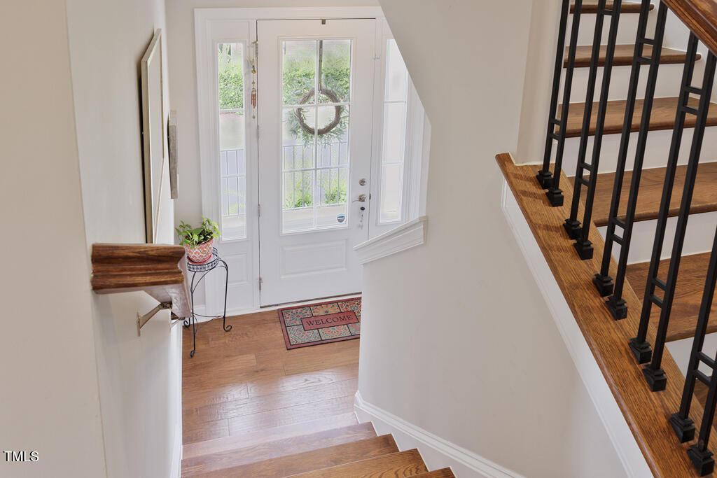 910 Wake Towne Drive Raleigh, NC 27609 - Photo 16 of 45 a view of an entryway with wooden floor