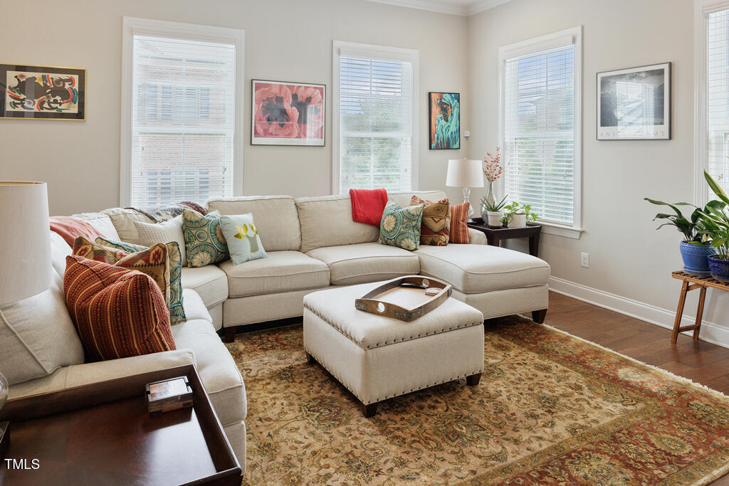 910 Wake Towne Drive Raleigh, NC 27609 - Photo 2 of 45 a living room with furniture and a couch