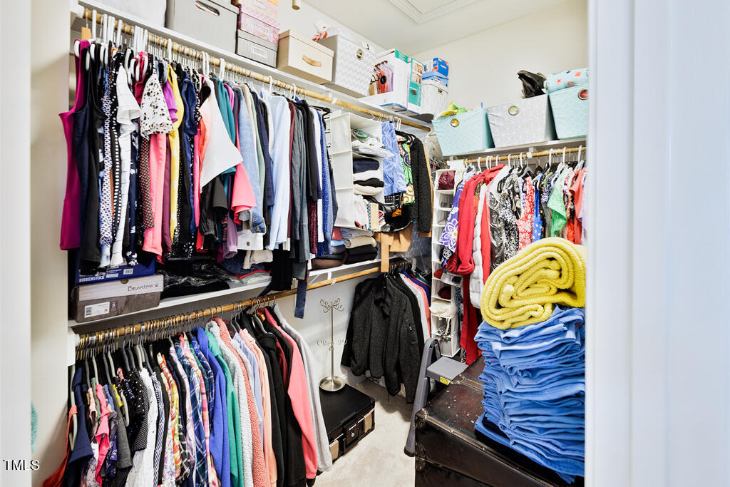 910 Wake Towne Drive Raleigh, NC 27609 - Photo 24 of 45 a view of walk in closet with clothes