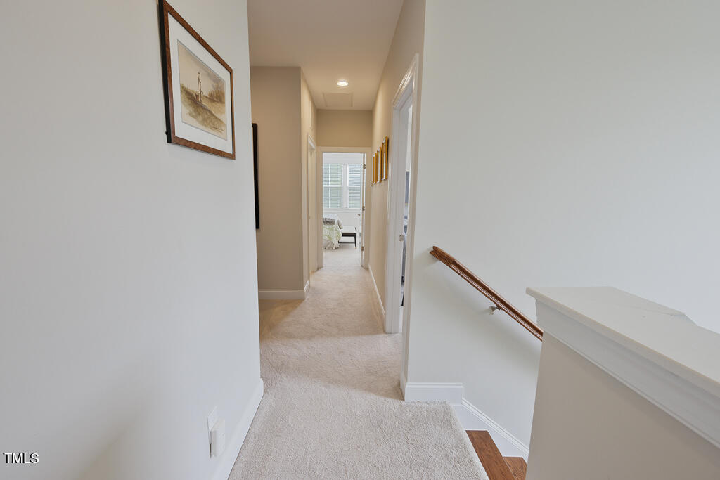 910 Wake Towne Drive Raleigh, NC 27609 - Photo 25 of 45 a view of a hallway with staircase