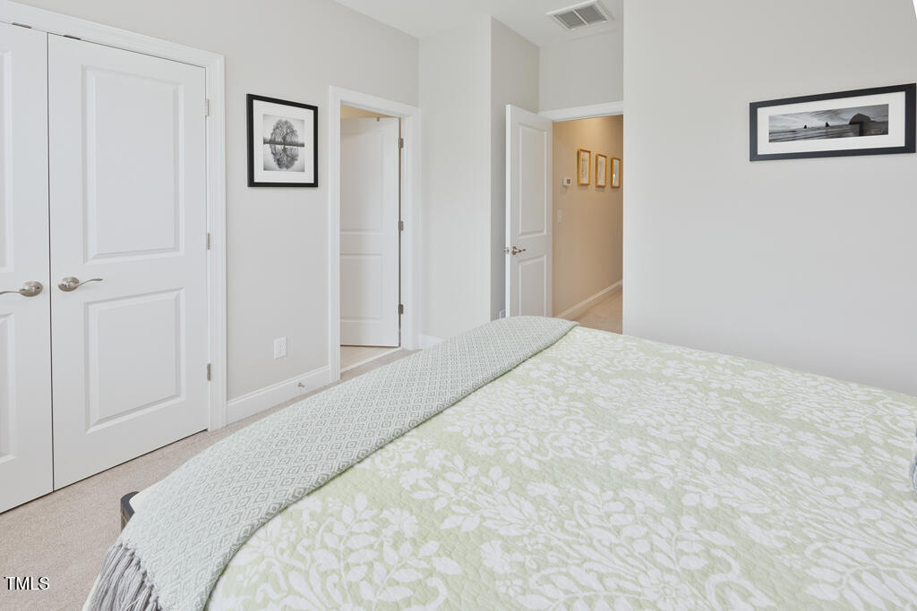 910 Wake Towne Drive Raleigh, NC 27609 - Photo 31 of 45 a bed room with a bed and a window