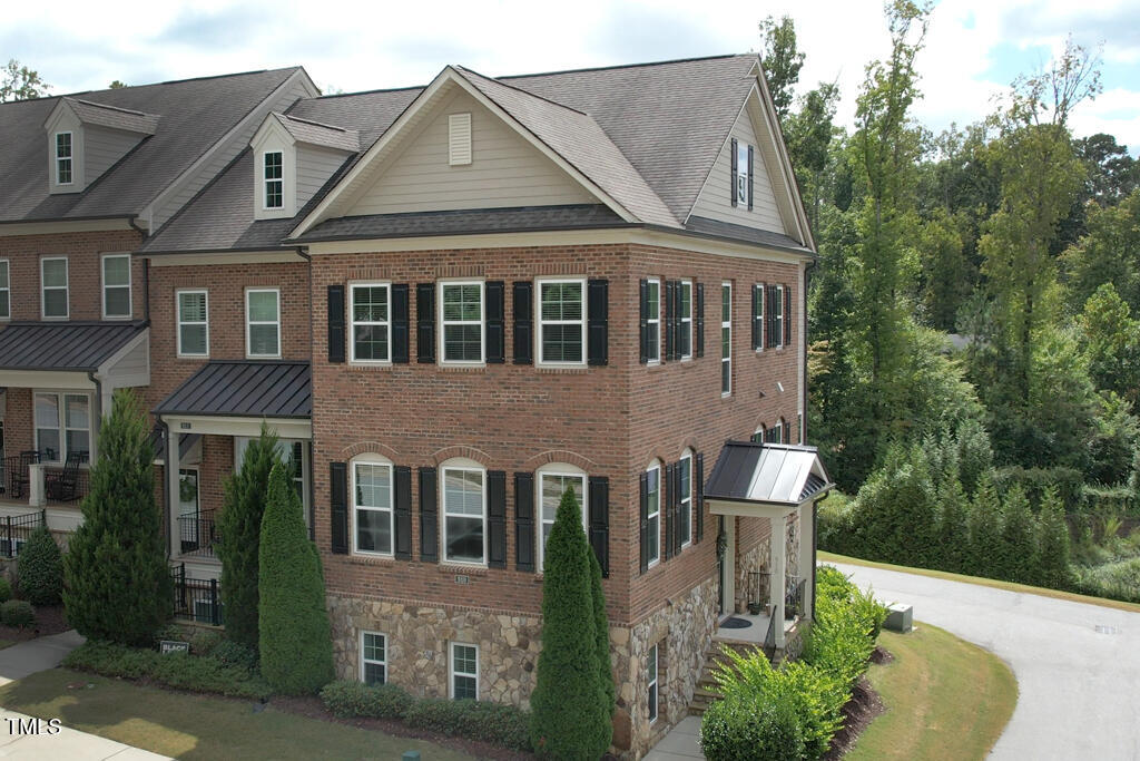910 Wake Towne Drive Raleigh, NC 27609 - Photo 35 of 45 a front view of a house with a yard