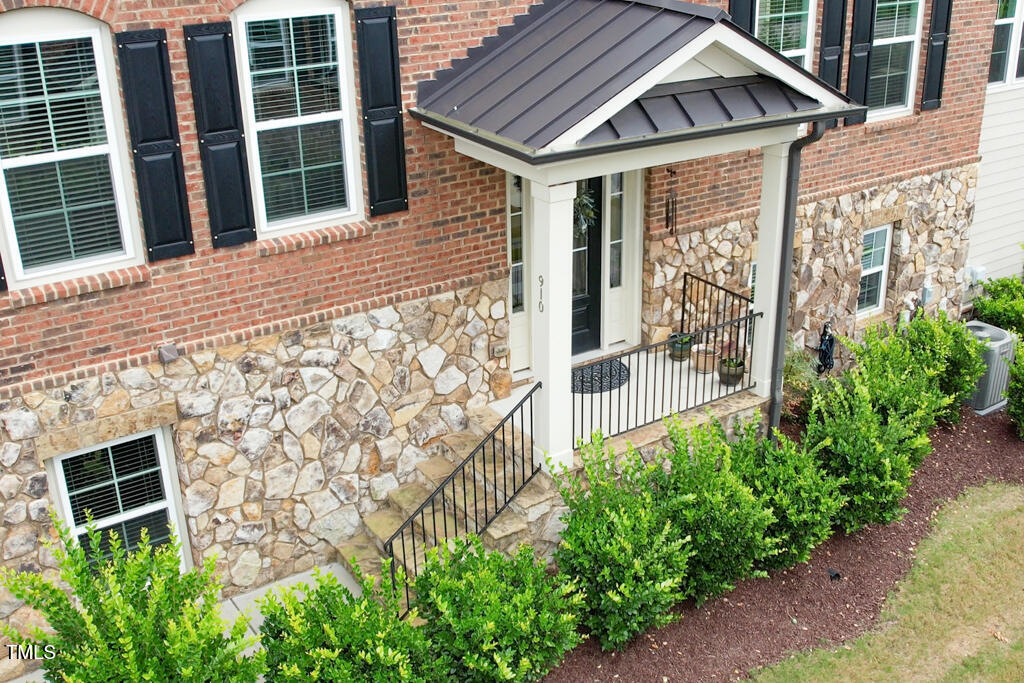 910 Wake Towne Drive Raleigh, NC 27609 - Photo 39 of 45 a yellow house with lots of green space