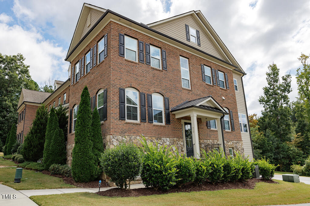 910 Wake Towne Drive Raleigh, NC 27609 - Photo 40 of 45 a front view of a house with a yard