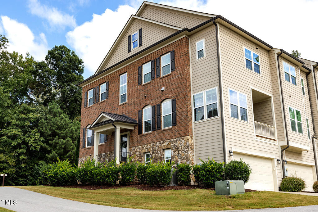 910 Wake Towne Drive Raleigh, NC 27609 - Photo 43 of 45 a front view of a house with garden