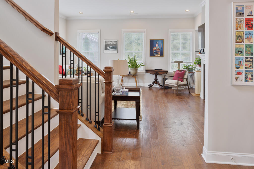910 Wake Towne Drive Raleigh, NC 27609 - Photo 5 of 45 a living room with furniture and a wooden floor
