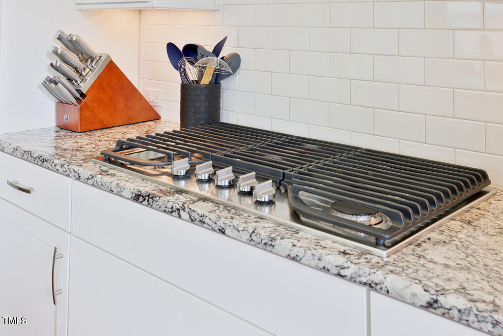 910 Wake Towne Drive Raleigh, NC 27609 - Photo 7 of 45 a view of a fireplace in the kitchen