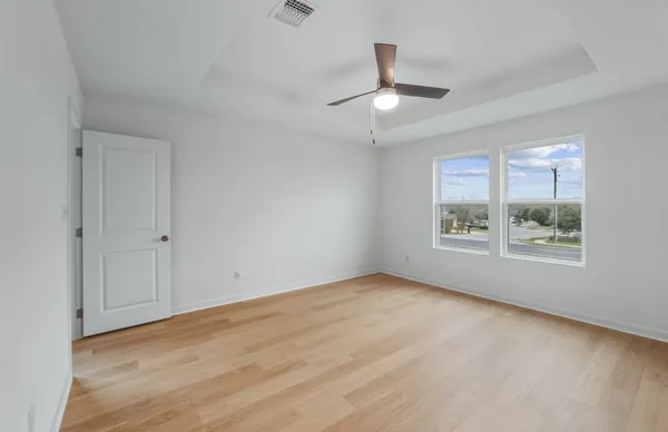 a spacious bathroom with a sink a toilet and shower