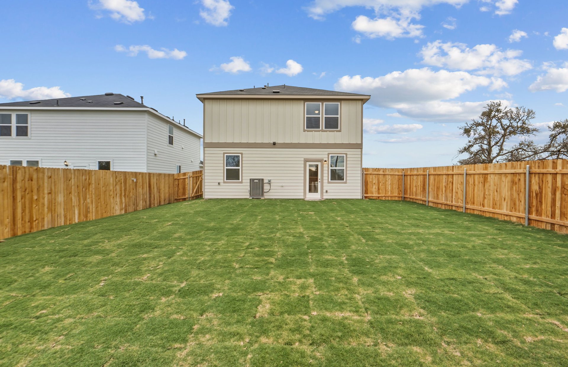 341 Sullivan Way Elgin, TX 78621 - Photo 20 of 23 a view of a house with backyard and wooden fence