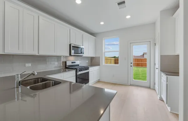 a picture of a bathroom with a sink and a mirror