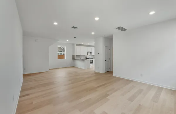 a kitchen with stainless steel appliances granite countertop a refrigerator sink and stove