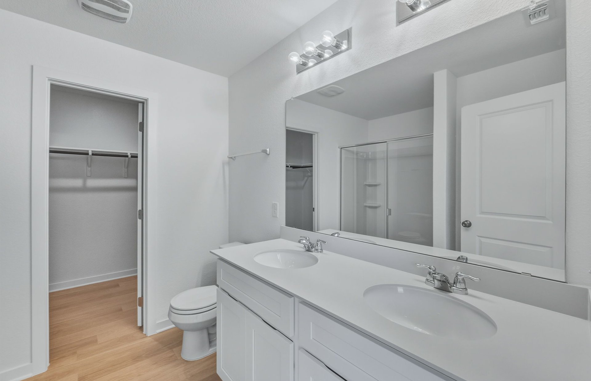 341 Sullivan Way Elgin, TX 78621 - Photo 8 of 23 a bathroom with a toilet a sink a mirror and a shower