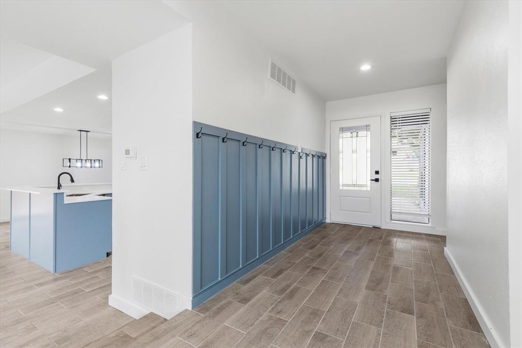 17003 Davenport Road Dallas, TX 75248 - Photo 5 of 40 a view of hallway with wooden floor