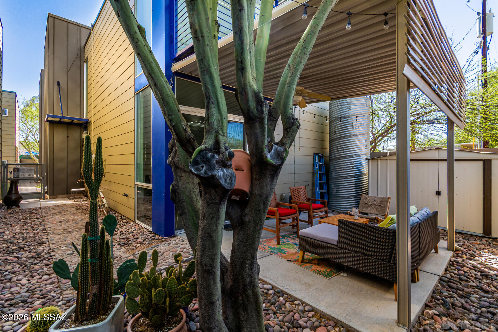 3605 East 3rd Street Tucson, AZ 85716 - Photo 32 of 39 Shaded back patio, perfect space for hosting guests! Featuring a water harvesting system and storage shed.